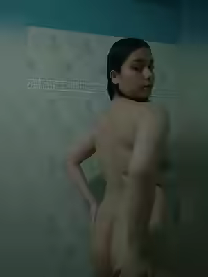 Cute Girl Displays Her Figure in Bathroom