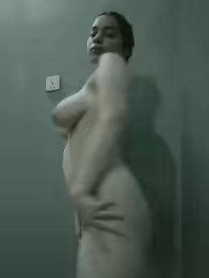 Cute Girl Displays Her Figure in Bathroom
